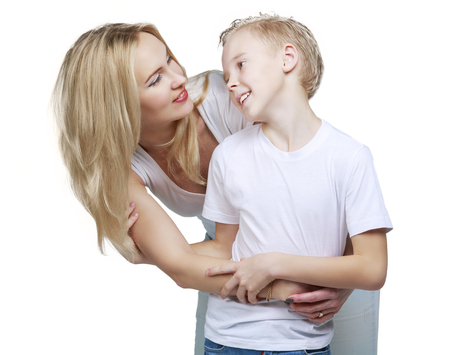 happy smiling mother and son, isolated against white backgroundの写真素材