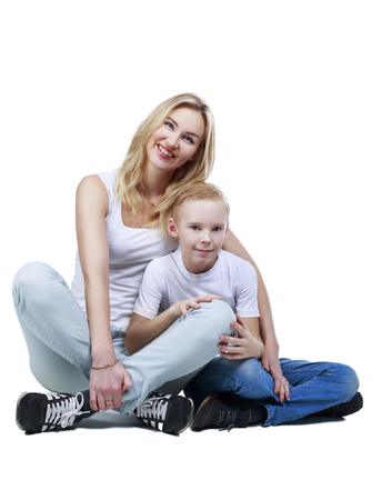 happy smiling mother and son, isolated against white backgroundの写真素材