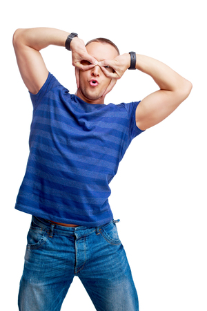 portrait of a happy  young man making faces isolated against white backgroundの写真素材