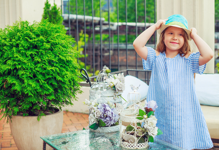 happy little girl  in the terrace at homeの写真素材