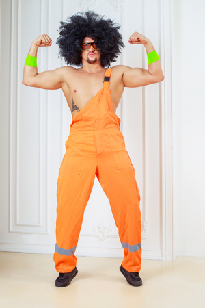 muscular dancer with retro disco halloween costumeの写真素材