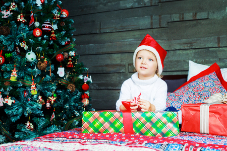happy girl at home with Christmas presentsの写真素材