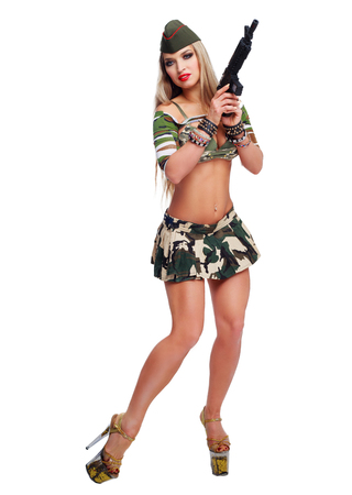 beautiful  striptease dancer, dressed as a soldier, isolated against white backgroundの写真素材