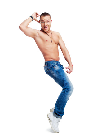 portrait of a happy smiling young dancing man isolated against white backgroundの写真素材