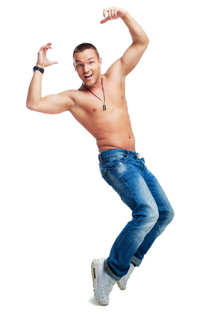 portrait of a happy smiling young dancing man isolated against white backgroundの写真素材