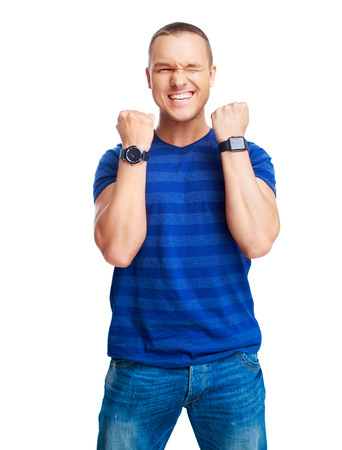 portrait of a young man showing excitement, plaseure and happiness, isolated against white backgroundの写真素材