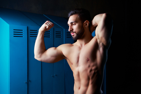 handsome muscular athletic man in the locker room after working outの写真素材