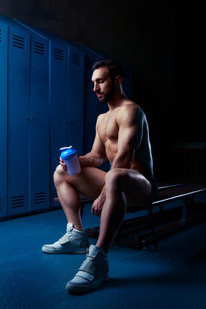 handsome muscular athletic man in the locker room after working outの写真素材