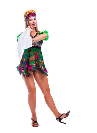 beautiful woman striptease dancer performing russian traditional folk dance, isolated against whiteの写真素材
