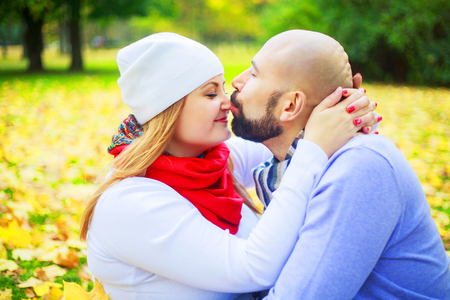 happy young couple walking and having fun in the autumn parkの写真素材