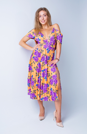 attractive  young woman  wearing a  dress  in the studioの写真素材