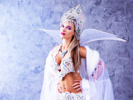 beautiful young woman wearing a traditional Russian   hat and sparkling bikini , Christmas costumeの写真素材