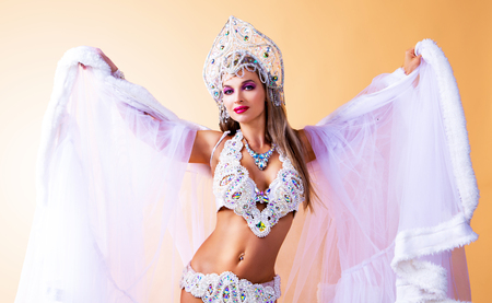 beautiful young woman wearing a traditional Russian   hat and sparkling bikini , Christmas costumeの写真素材
