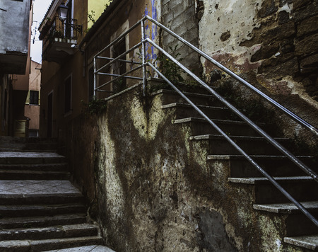 La Maddalena, Sardinia, Italy, old walls and stairs of the buildings in the center of the townの写真素材