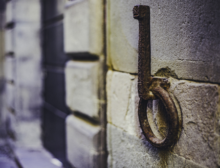 the ancient  hitching post on the wall of a building in Lucca, Italy, spring 2018の写真素材