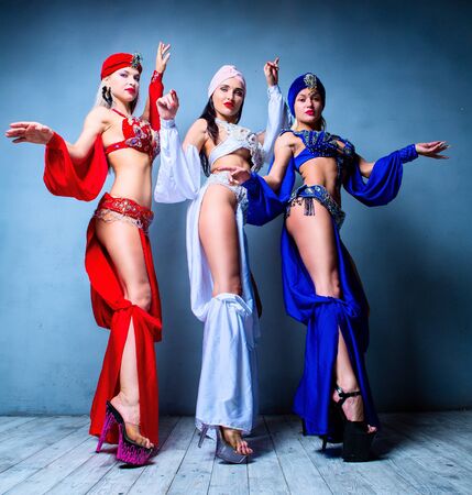 beautiful sexy women wearing  stage costumes of a belly-dancers, in the studioの写真素材