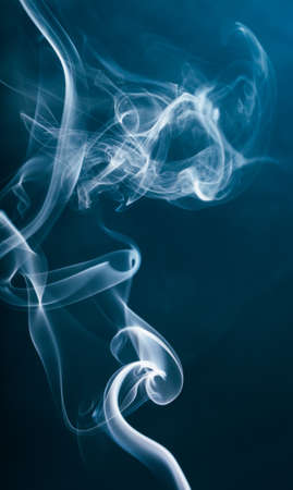 smoke from the incense stick aroma isolated on backgroundの写真素材