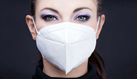 Woman wearing face mask, closeup, epidemia conceptの写真素材