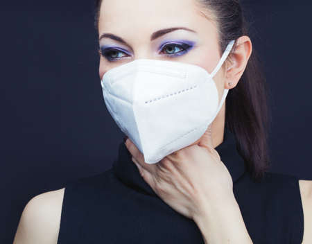 Woman wearing a face mask, closeup, epidemia conceptの写真素材