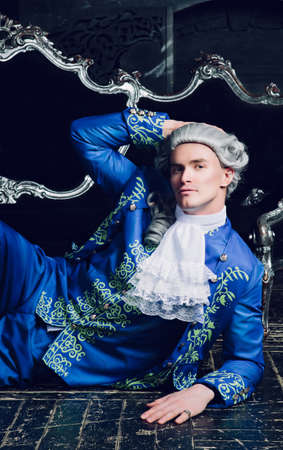 actor dressed as an aristocrat from the eighteenth century wearing a wig