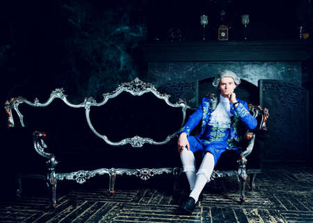 actor dressed as an aristocrat from the eighteenth century wearing a wig