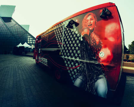 Cleveland, Ohio, USA - July 19, 2021: Rock and Roll Hall of Fame entrance and a bus parked besides it.のeditorial素材