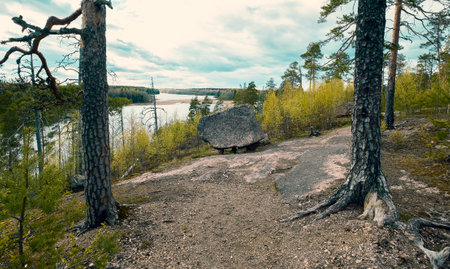Seid or megalith, stone with legs on a bald mountain above Lake Iloranta. beautiful northern nature late autumnの写真素材