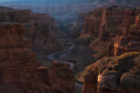 Canyon of the Charyn River in Kazakhstan, Beautiful view of the clay rocks and the road to the gorge at sunset. Valley of Castlesの写真素材