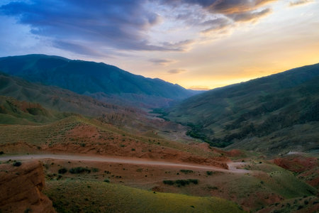 Panorama Tract Zhaman uy in mountains of Kazakhstan on platey Assy. Fantastic clay remains of a red color on summer eveningの写真素材