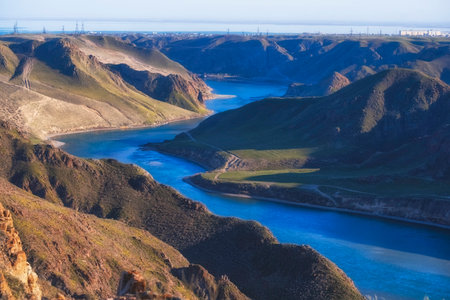 Beautiful large river Ili in Kazakhstan with blue transparent water, top view in the spring