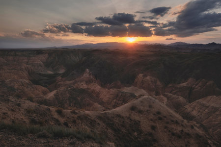 Yellow Canyon is also called the lunar canyon in Kazakhstan near the Charyn River at sunset with the rays of the sun on the heights of clay castles.の写真素材