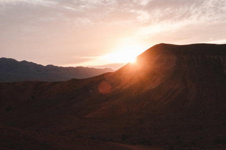 Beautiful orange sunset in desert mountains. Ancient mountains in Almaty region of Kazakhstanの写真素材