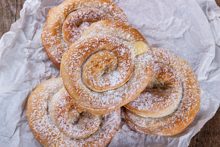 Crispy spiral sweet pies with cream filling