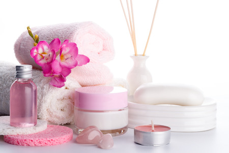 Spa setting and health care items, body lotion,soap,aroma sticks,oil, sponges and towels.の写真素材