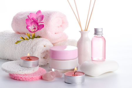 Spa setting and health care items, body lotion,soap,aroma sticks,oil, sponges and towels.の写真素材