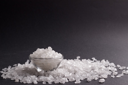 White salt crystals on black background, selective focusの写真素材
