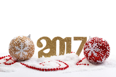 Happy New Year 2017, red and gold decorations on snowの写真素材