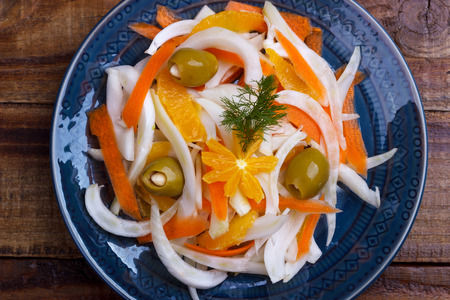 Fennel salad with orange, carrots and olives stuffed with almonds. Closeupの写真素材