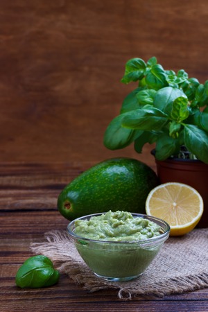 avocado guacamole sauce with ingredients, traditional Mexican dip and ingredientsの写真素材