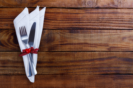 Romantic table setting on white wooden table. Valentine's day card templateの写真素材