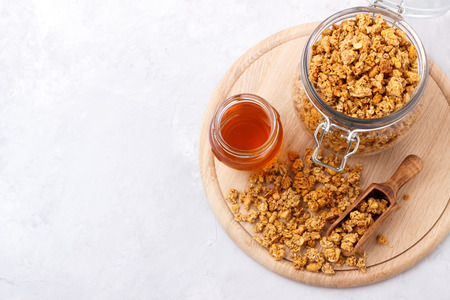 Healthy breakfast with homemade oat and coconut granola on white backgroundの写真素材