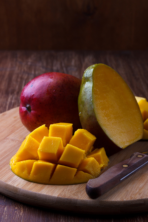 Fresh mango organic product on wooden backgroundの写真素材