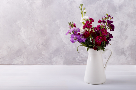 Bouquet of fragrant purple,white,pink and red flowers matthiola in a vaseの写真素材