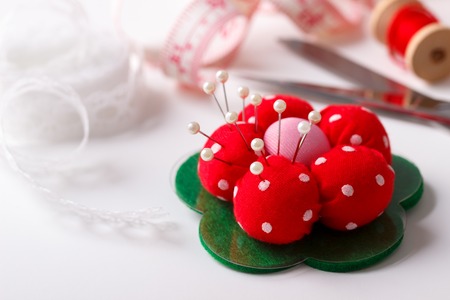 needle bed and other tools for sewing on white background,selective focus, macroの写真素材