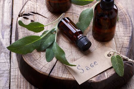 Sage and essential oil in a bottle, alternative medicine and spaの写真素材