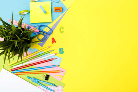 Back to school concept. Colorful stationary school supplies on yellow trendy background, space or text flat layの写真素材