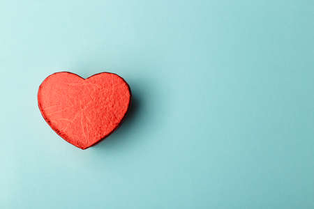 Red heart on blue background with copy space. Gift box mock up or card template. Romantic or Valentineâs dayの写真素材