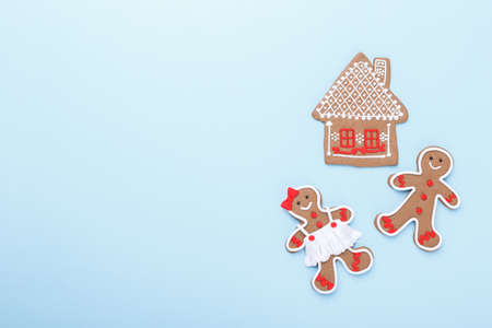 Gingerbread cookies on blue background with copy space. Christmas or new year baking