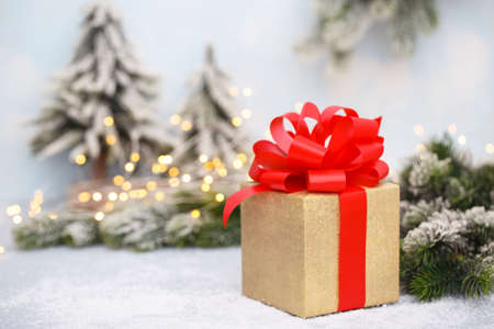 Golden gift box and festive lights, Christmas or New year card, winter family holidays