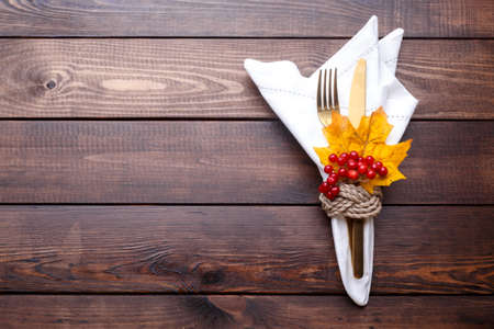 Autumn table setting on old wooden table Thanksgiving or Octoberfest vintage background copy space